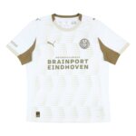 Camisa PSV III 25/26 off-white com listras inspiradas no Philips Stadium, escudo clássico Heritage e detalhes em bege e verde-escuro.