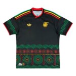 Camisa reserva da Jamaica 2026 preta com padrão gráfico de ondas sonoras LPs masculina torcedor.